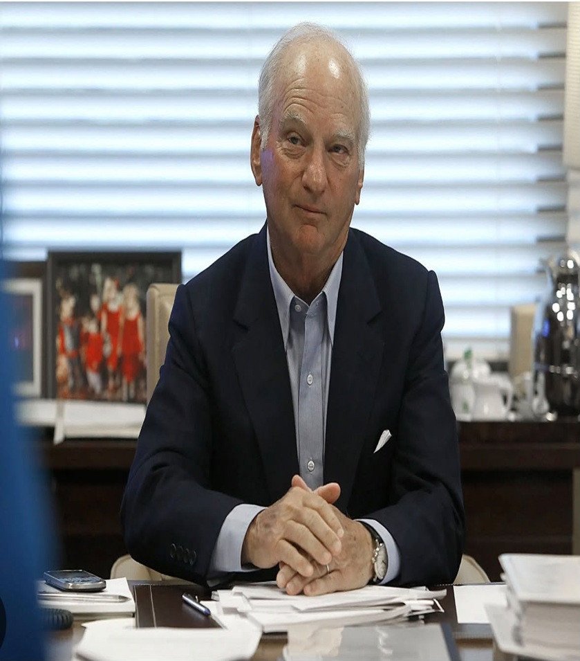 Man seated at a desk in an office
