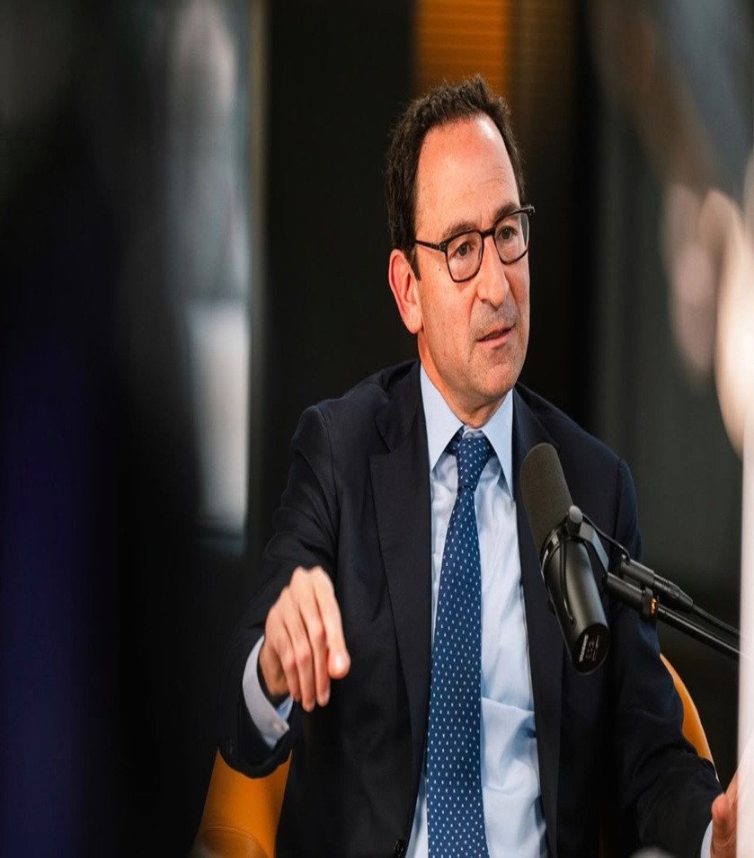 Man speaking at a microphone