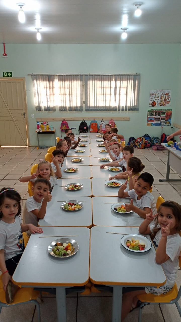 People seated at tables in a dining hall